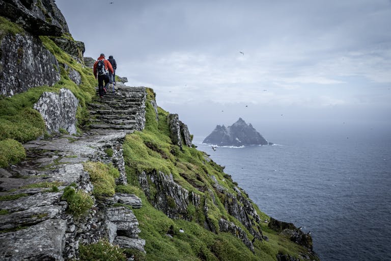 Dublin Docklands, Dublin City Hikers explore the rugged paths of Skellig Michael with a view of the Atlantic Ocean.