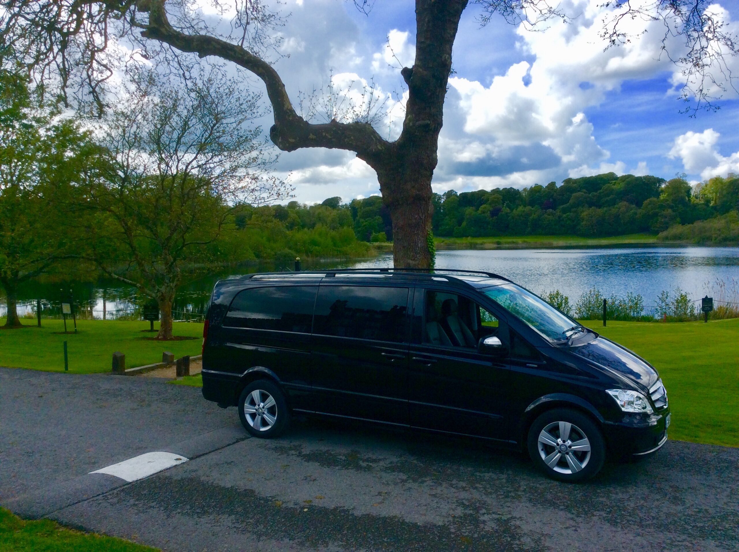 One of our luxurious Mercedes 6 seaters on tour at Dromoland Castle